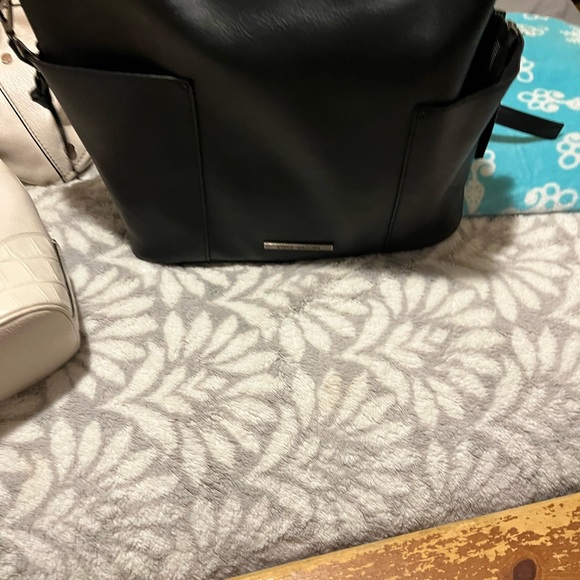 Black Steve Madden bag lots of room and pockets. - Picture 3 of 3